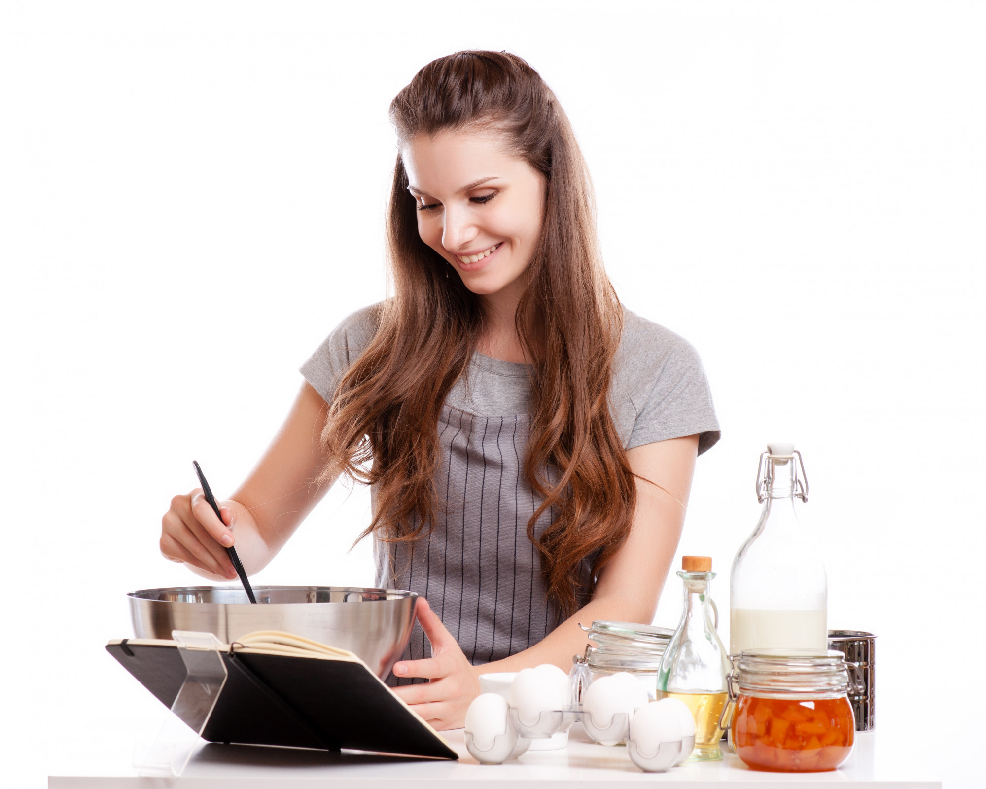 Student tasting sauce during lesson